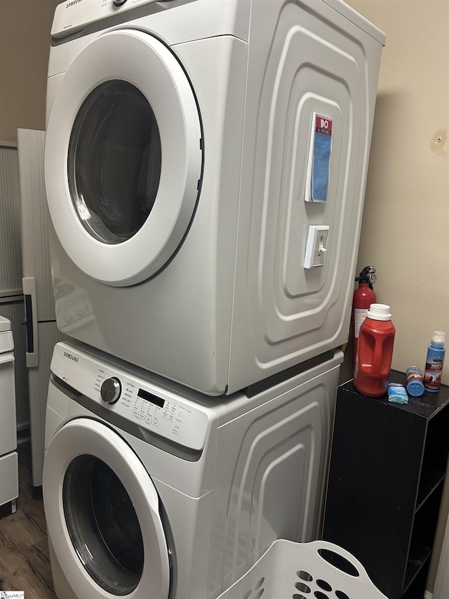 101 Elm St, Clinton, SC 29325 - laundry area with stacked washer and clothes dryer and wood finished floors