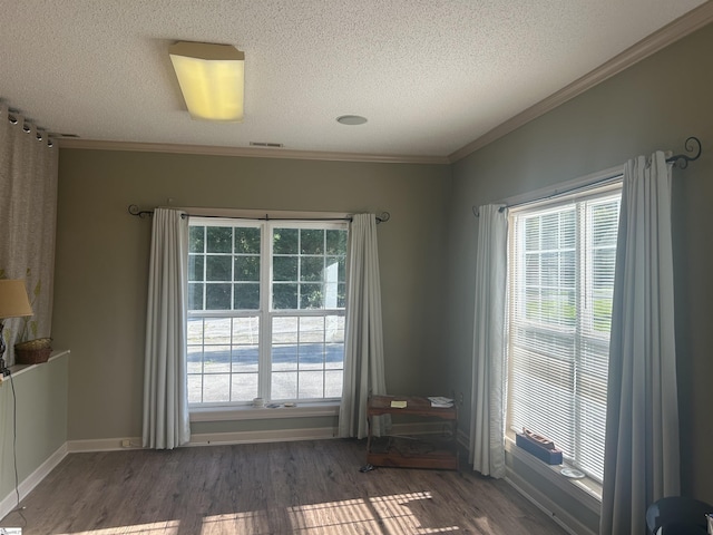 101 Elm St, Clinton, SC 29325 - empty room with a textured ceiling, crown molding, and wood finished floors