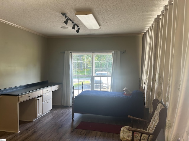 101 Elm St, Clinton, SC 29325 - bedroom with rail lighting, a textured ceiling, dark wood finished floors, a ceiling fan, and crown molding