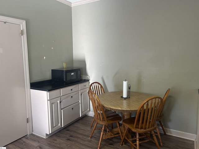 101 Elm St, Clinton, SC 29325 - dining space featuring dark wood-style floors and crown molding