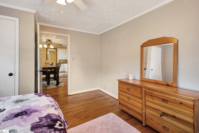 506 Piedmont Hwy, Piedmont, SC 29673 - bedroom featuring wood finished floors, ornamental molding, a textured ceiling, and ceiling fan