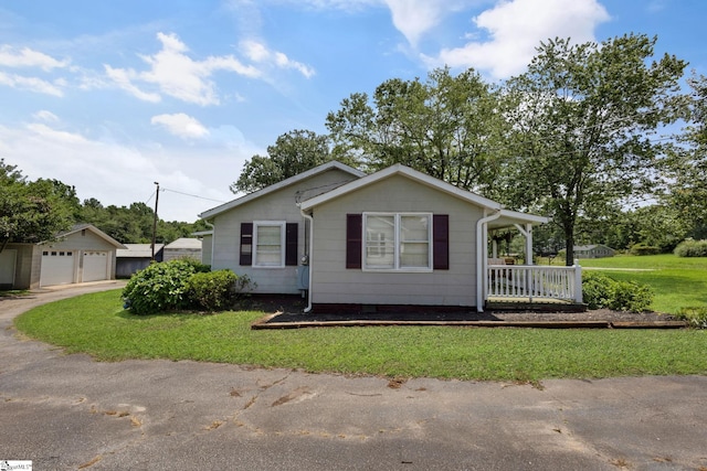 506 Piedmont Hwy, Piedmont, SC 29673 - view of front of home with a detached garage, a front yard, a porch, and crawl space