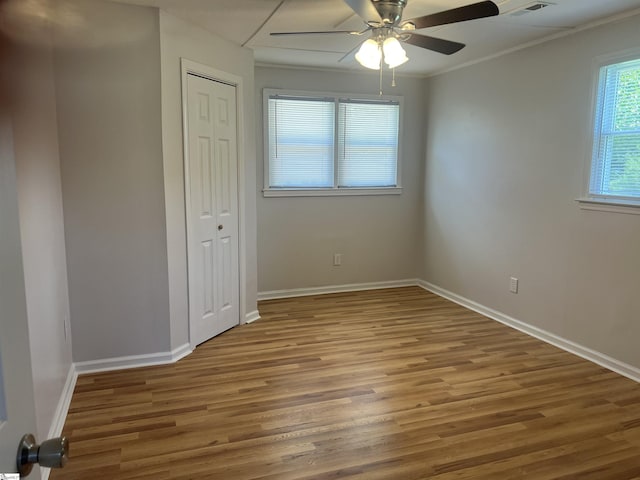 3023 Plainview Rd, Anderson, SC 29626 - unfurnished bedroom with wood finished floors, a closet, ceiling fan, and crown molding