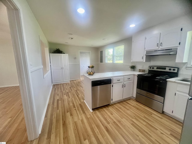 3023 Plainview Rd, Anderson, SC 29626 - kitchen featuring stainless steel appliances, under cabinet range hood, a peninsula, white cabinetry, and recessed lighting
