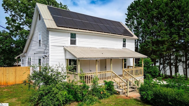 17 Smythe St, Pelzer, SC 29669 - view of front of house featuring a porch, solar panels, and a metal roof