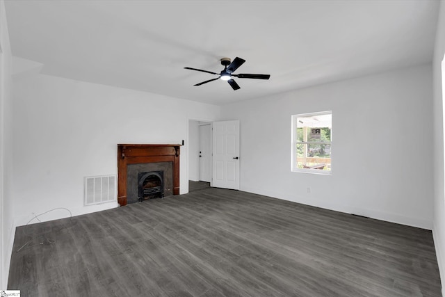17 Smythe St, Pelzer, SC 29669 - unfurnished living room with dark wood finished floors, a ceiling fan, and a fireplace