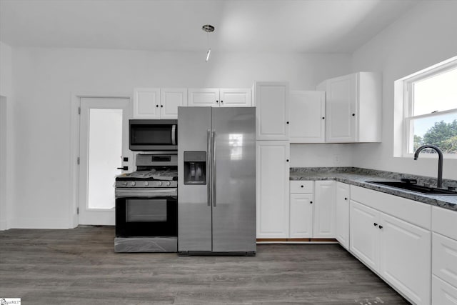 17 Smythe St, Pelzer, SC 29669 - kitchen featuring stainless steel appliances, white cabinets, wood finished floors, and stone countertops
