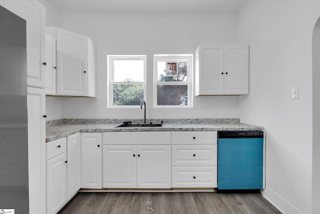 17 Smythe St, Pelzer, SC 29669 - kitchen featuring dishwasher, wood finished floors, and white cabinetry