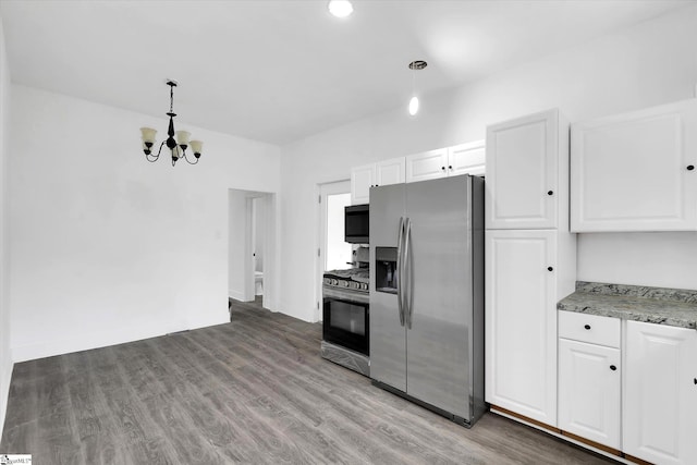 17 Smythe St, Pelzer, SC 29669 - kitchen featuring stainless steel appliances, white cabinetry, a chandelier, and decorative light fixtures