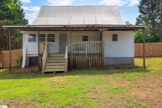 17 Smythe St, Pelzer, SC 29669 - rear view of property featuring a metal roof and covered porch