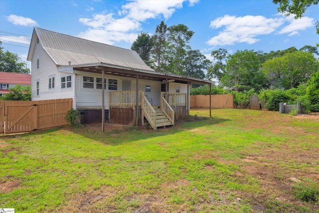 17 Smythe St, Pelzer, SC 29669 - rear view of property featuring a fenced backyard, a metal roof, a gate, and stairs