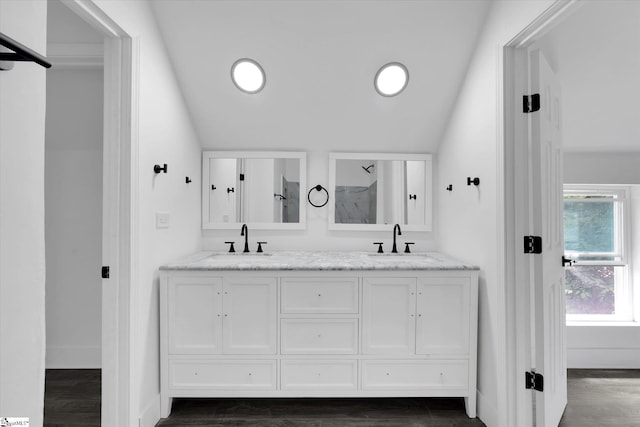 17 Smythe St, Pelzer, SC 29669 - bathroom with double vanity, lofted ceiling, wood finished floors, recessed lighting, and a shower