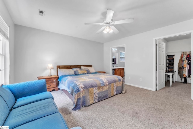 150 Mountain View Cir, Inman, SC 29349 - carpeted bedroom with ensuite bath, multiple windows, ceiling fan, and a walk in closet