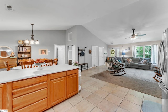 150 Mountain View Cir, Inman, SC 29349 - kitchen featuring open floor plan, freestanding refrigerator, lofted ceiling, light tile patterned flooring, and light countertops
