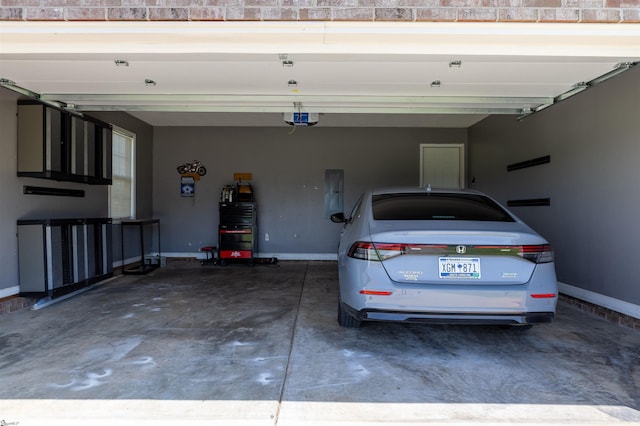 105 Hidden Springs Ct, Gaffney, SC 29341 - garage featuring a garage door opener, electric panel, and driveway