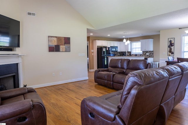 105 Hidden Springs Ct, Gaffney, SC 29341 - living room with a fireplace, recessed lighting, vaulted ceiling, and light wood-style flooring