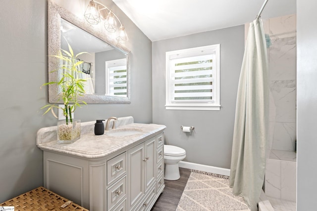 1142 Cooper Bridge Rd, Woodruff, SC 29388 - full bath with vanity, curtained shower, and wood finished floors