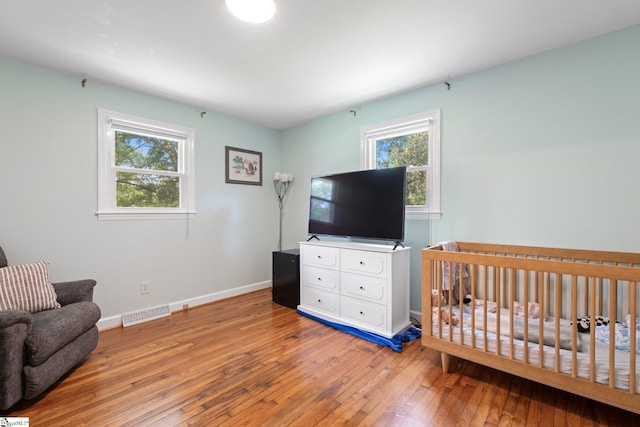 1142 Cooper Bridge Rd, Woodruff, SC 29388 - bedroom featuring hardwood / wood-style floors and multiple windows