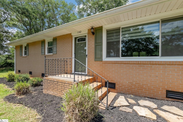 1142 Cooper Bridge Rd, Woodruff, SC 29388 - doorway to property with crawl space and brick siding