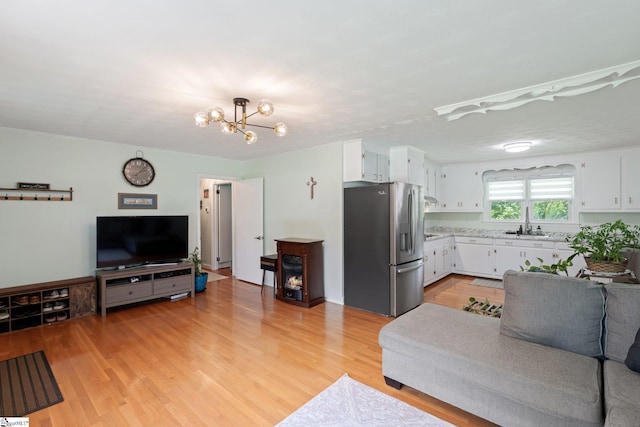1142 Cooper Bridge Rd, Woodruff, SC 29388 - living area with light wood-style flooring and a chandelier