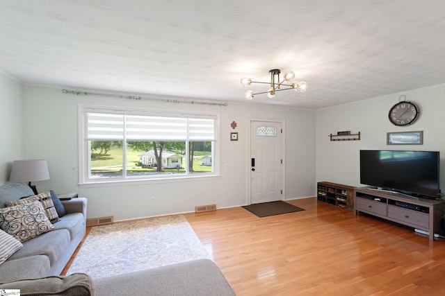 1142 Cooper Bridge Rd, Woodruff, SC 29388 - living room featuring a chandelier and light wood-style floors