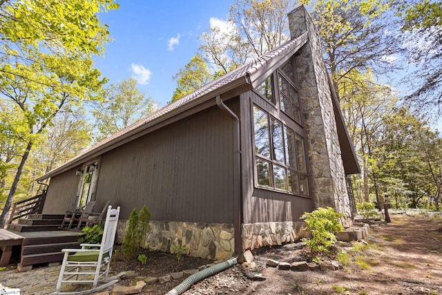 207 Sassafras Dr, Taylors, SC 29687 - view of side of property featuring a chimney and a wooden deck