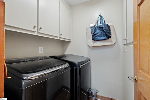 207 Sassafras Dr, Taylors, SC 29687 - laundry room featuring washer and clothes dryer and cabinet space