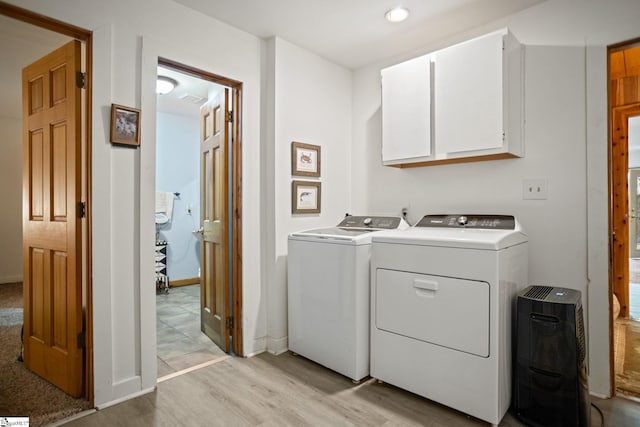 207 Sassafras Dr, Taylors, SC 29687 - laundry area with cabinet space, independent washer and dryer, and light wood finished floors