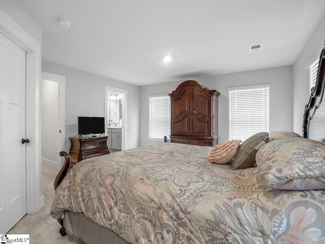1215 Cherry Orchard Rd, Moore, SC 29369 - bedroom with light colored carpet and ensuite bathroom