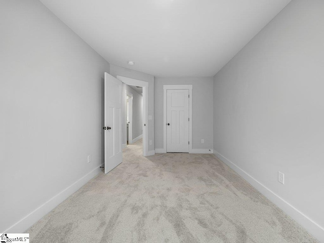 1215 Cherry Orchard Rd, Moore, SC 29369 - unfurnished bedroom with baseboards and light colored carpet