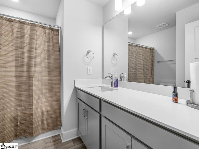 1215 Cherry Orchard Rd, Moore, SC 29369 - full bathroom featuring wood finished floors, vanity, recessed lighting, and curtained shower