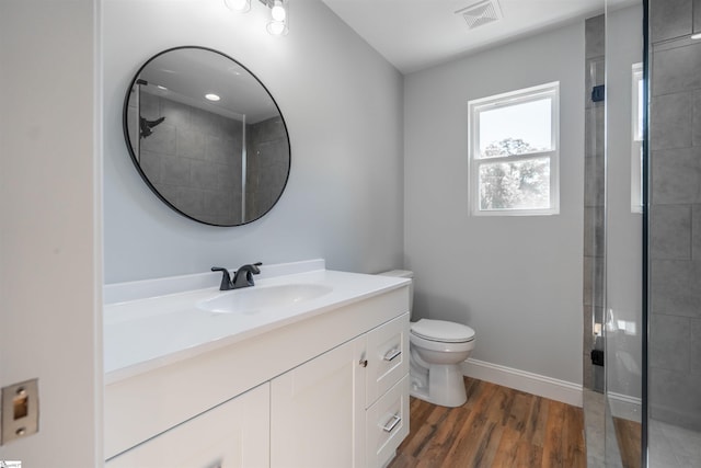5 Mcgee St, Belton, SC 29627 - bathroom with vanity, tiled shower, and wood finished floors