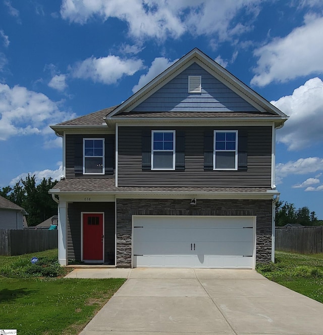 638 Grantleigh Dr, Duncan, SC 29334 - view of front facade with stone siding, a garage, driveway, and roof with shingles