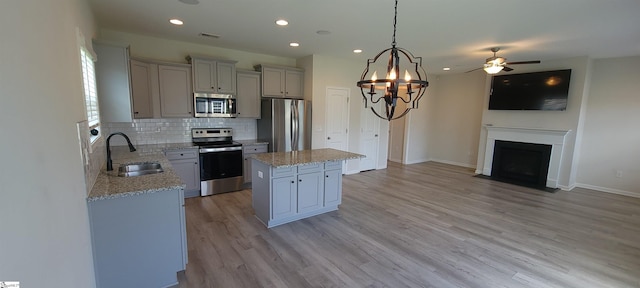638 Grantleigh Dr, Duncan, SC 29334 - kitchen featuring stainless steel appliances, a kitchen island, recessed lighting, backsplash, and light wood-type flooring