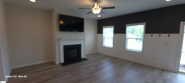 638 Grantleigh Dr, Duncan, SC 29334 - unfurnished living room with light wood-style floors, a fireplace with flush hearth, a ceiling fan, and recessed lighting