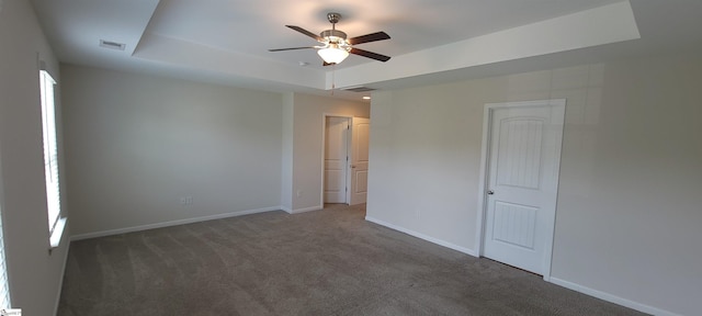 638 Grantleigh Dr, Duncan, SC 29334 - unfurnished bedroom with carpet, a tray ceiling, and a ceiling fan