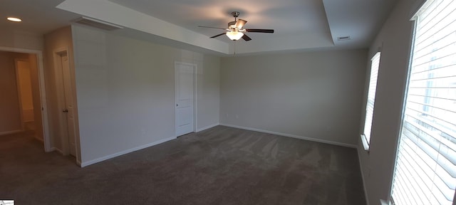 638 Grantleigh Dr, Duncan, SC 29334 - unfurnished room with dark colored carpet, ceiling fan, a tray ceiling, and recessed lighting
