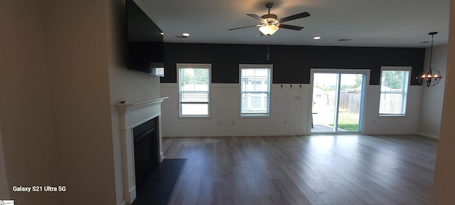 638 Grantleigh Dr, Duncan, SC 29334 - unfurnished living room featuring a fireplace, wood finished floors, a chandelier, a ceiling fan, and recessed lighting