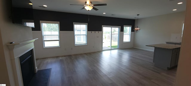 638 Grantleigh Dr, Duncan, SC 29334 - unfurnished living room with a fireplace, ceiling fan, plenty of natural light, wood finished floors, and recessed lighting