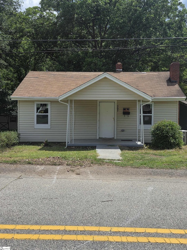 207 Sanders St, Honea Path, SC 29654 - single story home featuring covered porch and a chimney