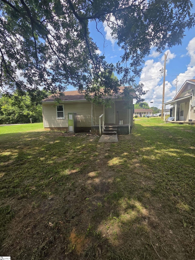 207 Sanders St, Honea Path, SC 29654 - rear view of house featuring a lawn and entry steps