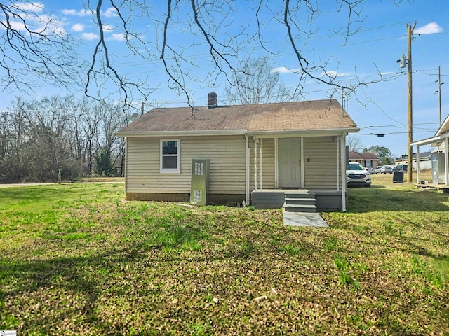 207 Sanders St, Honea Path, SC 29654 - rear view of property with a chimney and a yard