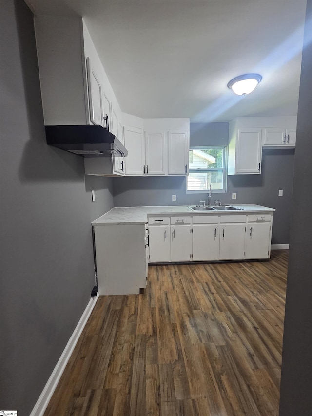 207 Sanders St, Honea Path, SC 29654 - kitchen featuring dark wood-style flooring, white cabinetry, and light countertops