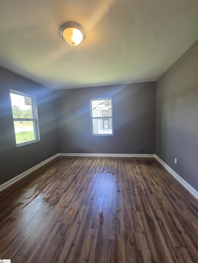 207 Sanders St, Honea Path, SC 29654 - spare room featuring dark wood-style floors and baseboards