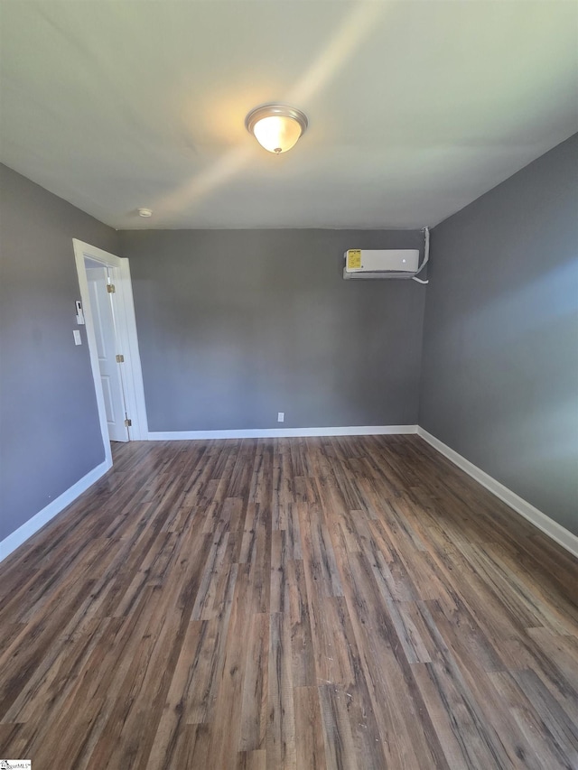 207 Sanders St, Honea Path, SC 29654 - empty room featuring dark wood finished floors and an AC wall unit