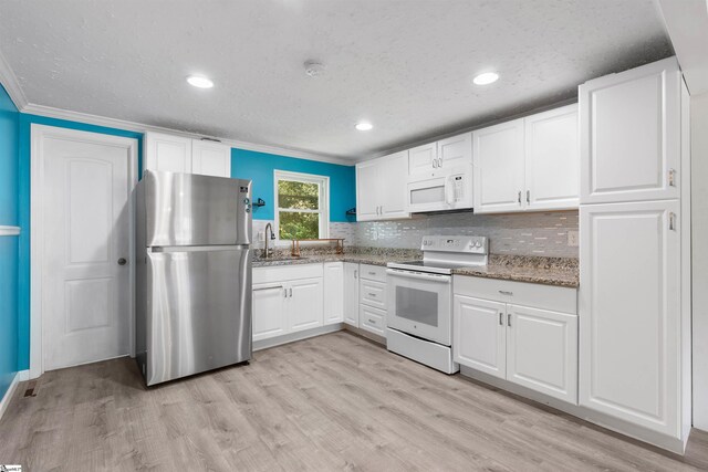 209 Edwards Rd, Lyman, SC 29365 - kitchen featuring white appliances, light stone counters, light wood-type flooring, crown molding, and recessed lighting