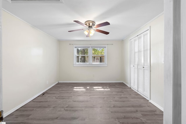 209 Edwards Rd, Lyman, SC 29365 - unfurnished bedroom featuring ornamental molding, wood finished floors, a closet, and ceiling fan