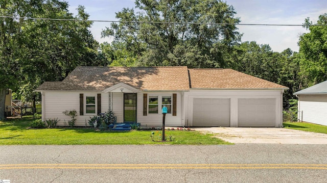 209 Edwards Rd, Lyman, SC 29365 - view of front facade featuring a garage, driveway, a front yard, and roof with shingles