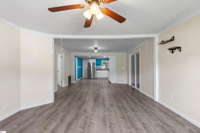 209 Edwards Rd, Lyman, SC 29365 - unfurnished living room with wood finished floors, ornamental molding, and a ceiling fan