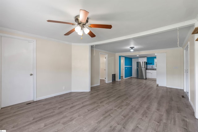209 Edwards Rd, Lyman, SC 29365 - unfurnished living room with a ceiling fan, crown molding, and wood finished floors